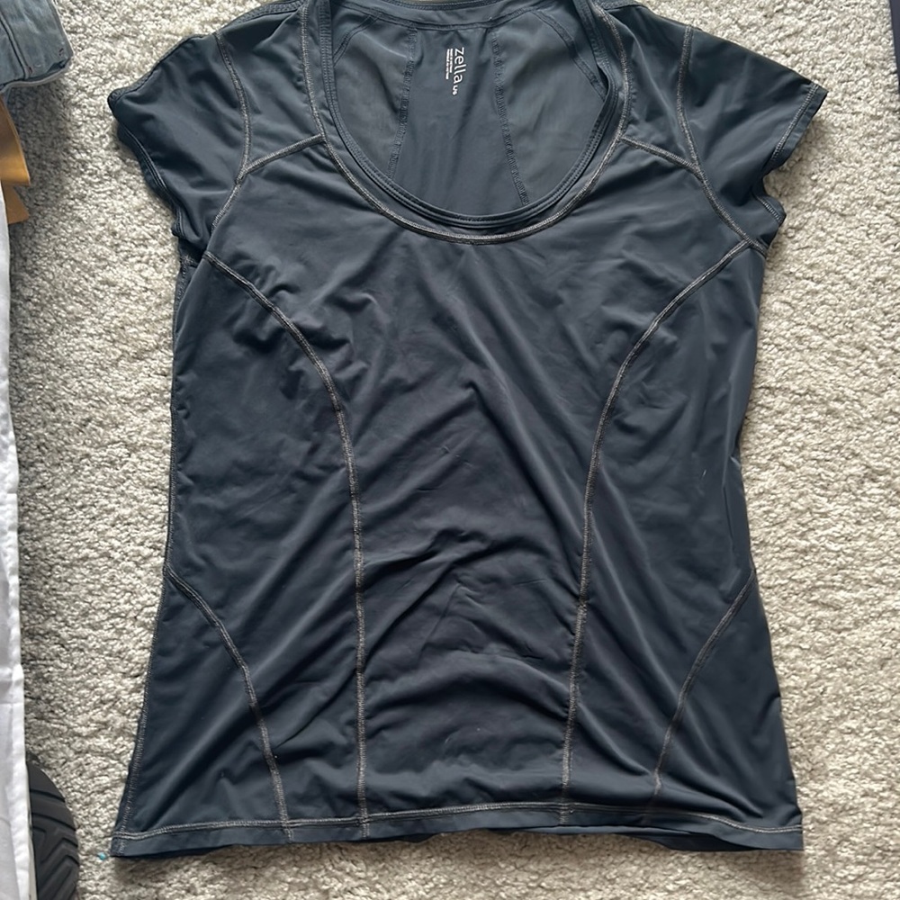 Workout Tee. Slightly Worn. Extremely comfortable and lightweight.